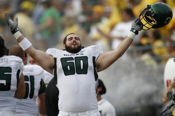 ANN ARBOR, MI - SEPTEMBER 08: Max Unger #60 of the Oregon Ducks celebrates on the sideline late in the fourth quarter against the Michigan Wolverines on September 8, 2007 at Michigan Stadium in Ann Arbor, Michigan. Oregon won the game 39-7.  (Photo By Gre