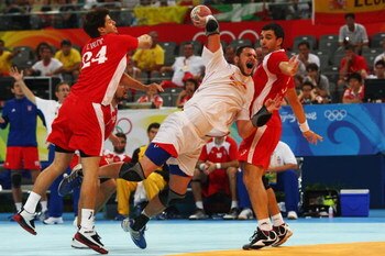 BEIJING - AUGUST 24:  Carlos Prieto of Spain shoots at goal marked by Tonci Valcic (L) and Renato Sulic of Croatia the Men's Handball Bronze Medal Match between Croatia and Spain held at the National Indoor Stadium during Day 16 of the Beijing 2008 Olympi