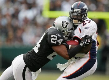 OAKLAND, CA - NOVEMBER 12:  Michael Huff #24 of the Oakland Raiders tackles Damien Nash #29 of the Denver Broncos during an NFL game at McAfee Coliseum on November 12, 2006 in Oakland, California. 