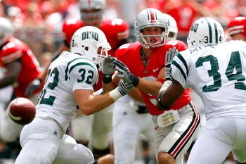 COLUMBUS, OH - SEPTEMBER 06:  Receiver Brian Hartline #9 of the Ohio State Buckeyes fails to pull in this reception against Lee Renfro #32 and Michael Mitchell #34 of the Ohio Bobcats during the game at Ohio Stadium on September 6, 2008 in Columbus, Ohio.