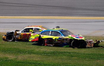 TALLADEGA, AL - APRIL 26:  Mark Martin, driver of the #5 Carquest/Kellogg's Chevrolet, and Jeff Gordon, driver of the #24 Dupont/Pepsi Chevrolet, come to a rest after a multi-car incident during the NASCAR Sprint Cup Series Aaron's 499 at Talladega Supers