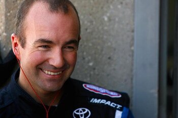FORT WORTH, TX - APRIL 03:  Marcos Ambrose, driver of the #47 Little Debbie/Clorox/Kingsford Toyota, stands in the garage area during practice for the NASCAR Sprint Cup Series Samsung 500 at Texas Motor Speedway on April 3, 2009 in Fort Worth, Texas.  (Ph