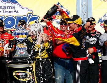 TALLADEGA, AL - APRIL 26:  Brad Keselowski, driver of the #09 Miccosukee Chevrolet, celebrates in victory lane after winning the NASCAR Sprint Cup Series Aaron's 499 at Talladega Superspeedway on April 26, 2009 in Talladega, Alabama.  (Photo by John Harre