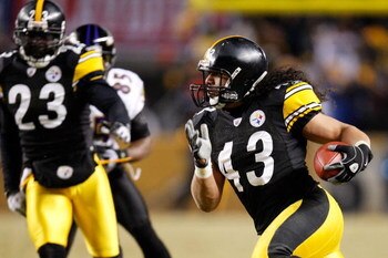 PITTSBURGH - JANUARY 18:  Safety Troy Polamalu #43 of the Pittsburgh Steelers returns an interception 40 yards for a touchdown against the Baltimore Ravens during the fourth quarter of the AFC championship game on January 18, 2009 at Heinz Field in Pittsb