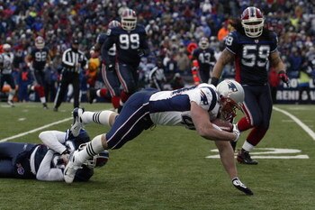 ORCHARD PARK, NY - DECEMBER 28:  Heath Evans #44 of the New England Patriots dives for extra yardage during the game against the Buffalo Bills on December 28, 2008 at Ralph Wilson Stadium in Orchard Park, New York. (Photo by Rick Stewart/Getty Images)