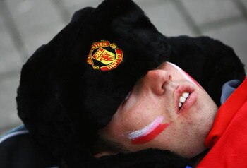 MOSCOW - MAY 21:  A Manchester United fan sleeps  prior to the late kick off during the UEFA Champions League Final match between Manchester United and Chelsea at the Luzhniki Stadium on May 21, 2008 in Moscow, Russia.  (Photo by Jamie McDonald/Getty Imag