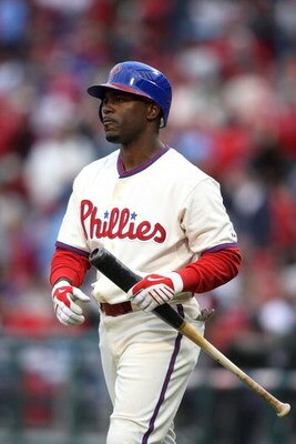 PHILADELPHIA - APRIL 08:  Jimmy Rollins #11 of the Philadelphia Phillies on deck to bat against the Atlanta Braves at Citizens Bank Park on April 8, 2009 in Philadelphia, Pennsylvania.  (Photo by Nick Laham/Getty Images)