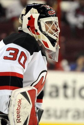 RALEIGH, NC - APRIL 26: Martin Brodeur #30 of the the New Jersey Devils keeps a close eye on the action in the first period of Game Six of the Eastern Conference Quarterfinals of the 2009 Stanley Cup Playoffs against the Carolina Hurricanes i on April 26,