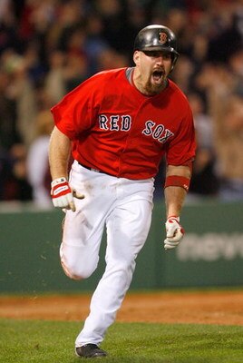 BOSTON - APRIL 24: Kevin Youkilis #20 of the Boston Red Sox celebrates his game-winning home run in the 11th inning against the New York Yankees at Fenway Park, April 24, 2009, in Boston, Massachusetts. (Photo by Jim Rogash/Getty Images)