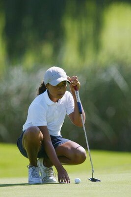 SAN DIEGO - July 17:  Cheyenne Woods, niece of Tiger Woods, lines up her putt on the 9th hole during the 2nd Round of the Junior World Golf Championships on July 17, 2002 at the Lawrence Welk Resort in San Diego, California.  (Photo by Dolanld Miralle/Get