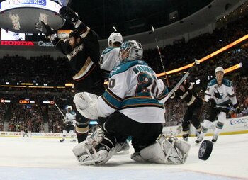 ANAHEIM, CA - APRIL 27:  Mike Brown #13 of the Anaheim Ducks celebrates a goal by Francois Beauchemin #23 as Evgeni Nabokov #20 of the San Jose Sharks looks on during Game Six of the Western Conference Quarterfinal Round of the 2009 Stanley Cup Playoffs a