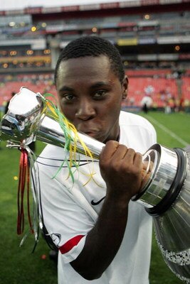 JOHANNESURG, SOUTH AFRICA - NOVEMBER 17:  Freddy Adu celebrates with the trophy during the Nelson Mandela Challenge match between South Africa and United States held at Ellis Park Stadium on November 17, 2007 in Johannesburg, South Africa.  (Photo by Left
