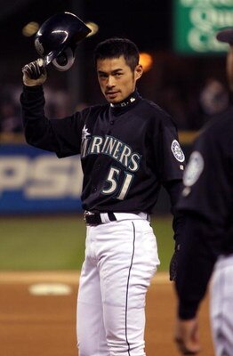 SEATTLE - OCTOBER 1:  Outfielder Ichiro Suzuki #51 of the Seattle Mariners celebrates after tying George Sisler's 84-year-old record for hits in a single season, during the game against the Texas Rangers on October 1, 2004 at Safeco Field in Seattle, Wash
