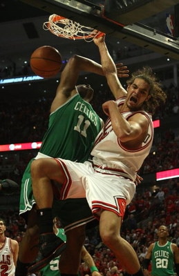 CHICAGO - APRIL 26: Joakim Noah #13 of the Chicago Bulls dunks the ball over Glen Davis #11 of the Boston Celtics in Game Four of the Eastern Conference Quarterfinals during the 2009 NBA Playoffs at the United Center on April 26, 2009 in Chicago, Illinois