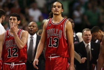 BOSTON - APRIL 28:  Kirk Hinrich #12 and Joakim Noah #13 of the Chicago Bulls look on during a time out against the Boston Celtics in Game Five of the Eastern Conference Quarterfinals during the 2009 NBA Playoffs at TD Banknorth Garden on April 28, 2009 i