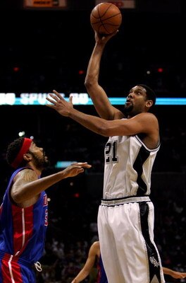 SAN ANTONIO - JUNE 23:  Tim Duncan #21 of the San Antonio Spurs puts a shot up over Rasheed Wallace #36 of the Detroit Pistons in Game seven of the 2005 NBA Finals at SBC Center on June 23, 2005 in San Antonio, Texas.  The Spurs defeated the Pistons 81-74