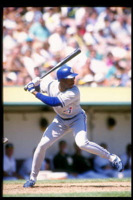 Sep 1993: Devon White of the Toronto Blue Jays swings at the ball during a game against the Oakland Athletics at the Oakland Coliseum in Oakland, Califoria. Mandatory Credit: Otto Greule /Allsport