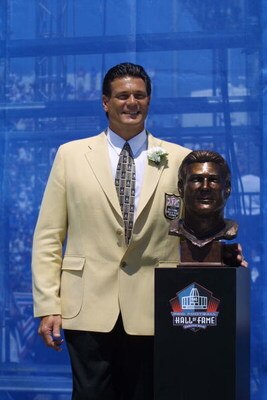CANTON, OHIO - AUGUST 3:  Dan Hampton stands next to his bust after his induction into the National Football League Hall of Fame on August 3, 2002 at Fawcett Stadium in Canton, Ohio.  Hampton played defensive end/defensive tackle for the Chicago Bears fro