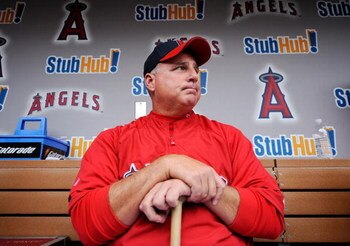 ANAHEIM, CA - APRIL 10:  Mike Scioscia #14 manager of the Los Angeles Angels reflects on pitcher Nick Adenhart's death as he answers questions in the dugout at Angel Stadium April 10, 2009 in Anaheim, California. Adenhart and two others were killed in car