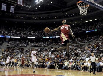 AUBURN HILLS, MI - APRIL 26:  LeBron James #23 of the Cleveland Cavaliers gets in for a first quarter break away dunk in front of Antonio McDyess #24 of the Detroit Pistons in Game Four of the Eastern Conference Quarterfinals during the 2009 NBA Playoffs 