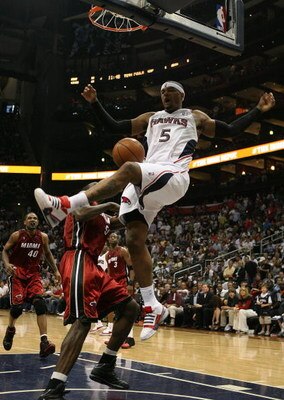 ATLANTA - MAY 03:  Josh Smith #5 of the Atlanta Hawks celebrates celebrates after dunking over Joel Anthony #50 of the Miami Heat during Game Seven of the Eastern Conference Quarterfinals at Philips Arena on May 3, 2009 in Atlanta, Georgia. The Hawks defe