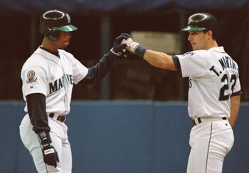 8 Oct 1995: SEATTLE CENTER FIELDER KEN GRIFFEY JR. CELEBRATES WITH TEAMMATE TINO MARTINEZ, AFTER GREFFEY HIT A SOLO HOMERUN IN THE 8TH INNING, MAKING THE SCORE 3-4 DURING THE MARINERS GAME VERSUS THE NEW YORK YANKEES IN GAME FIVE OF THE AMERICAN LEAGUE PL