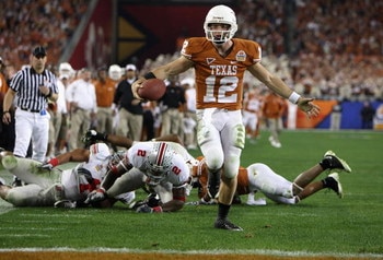 GLENDALE, AZ - JANUARY 05:  Quarterback Colt McCoy #12 of the Texas Longhorns scores on a 14 yard touchdown rush against the Ohio State Buckeyes during the third quarter of the Tostitos Fiesta Bowl Game on January 5, 2009 at University of Phoenix Stadium 