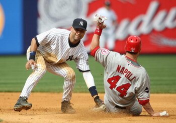 NEW YORK - MAY 02: Derek Jeter #2 of the New York Yankees tags out the steal of Mike Napoli #44 of the Los Angeles Angels of Anaheim at Yankee Stadium on May 2, 2009 in the Bronx borough of New York City.  (Photo by Nick Laham/Getty Images)
