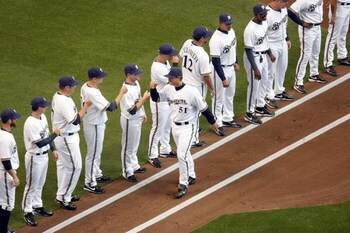 MILWAUKEE - APRIL 10:  Pitcher Trevor Hoffman #51 of the Milwaukee Brewers greets teammates in the introduction before the game against the Chicago Cubs during the Opening Day game on April 10, 2009 at Miller Park in Milwaukee, Wisconsin. (Photo byJonatha
