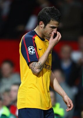 MANCHESTER, UNITED KINGDOM - APRIL 29:  Cesc Fabregas of Arsenal walks off the pitch dejectedly at the end of the UEFA Champions League Semi Final First Leg match between Manchester United and Arsenal at Old Trafford on April 29, 2009 in Manchester, Engla