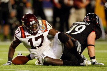 MIAMI - JANUARY 01:  Kam Chancellor #17 of the Virginia Tech Hokies reacts in pain after making an interception during the FedEx Orange Bowl against the Cincinnati Bearcats at Dolphin Stadium on January 1, 2009 in Miami, Florida.  (Photo by Streeter Lecka