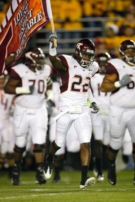 CHESTNUT HILL, MA - OCTOBER 18:  Stephen Virgil #22 of the Virginia Tech Hokies leads his team onto the field against the Boston College Eagles on October 18, 2008 at Alumni Stadium in Chestnut Hill, Massachusetts.  (Photo by Jim Rogash/Getty Images)