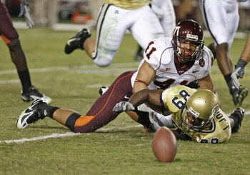 ATLANTA - NOVEMBER 1:  Wide receiver James Johnson #89 of the Georgia Tech Yellow Jackets fumbles as he is tackled by linebacker Cam Martin #41 of the Virginia Tech Hokies during the game on November 1, 2007 at Bobby Dodd Stadium at Historic Grant Field i