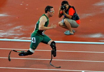 BEIJING, CHINA - SEPTEMBER 16:  Oscar Pistorius of South Africa wins Gold with a World Record in the 400m T44 during day 10 of the 2008 Beijing Paralympic Games held in Beijing, China.  (Photo by Duif du Toit/Gallo Images/Getty Images)