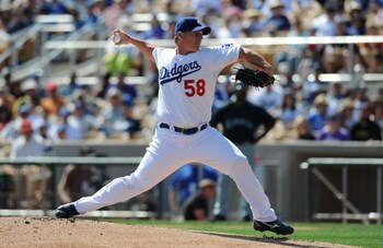 GLENDALE, AZ - MARCH 07:  Chad Billingsley #58 of the Los Angeles Dodgers pitches during a Spring Training game against the Seattle Mariners at Camelback Ranch on March 7, 2009 in Glendale, Arizona.  (Photo by Lisa Blumenfeld/Getty Images)