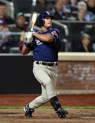 NEW YORK - APRIL 13:  Brian Giles #24 of the San Diego Padres bats against the New York Mets on April 13, 2009 at Citi Field in the Flushing neighborhood of the Queens borough of New York City.This is the first regular season MLB game being played at the 