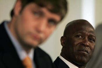 LAKE FOREST, IL - APRIL 3:  Chicago Bears head coach Lovie Smith looks on as new quarterback Jay Cutler talks to the media  during a press conference on April 3, 2009 at Halas Hall in Lake Forest, Illinois. (Photo by Jim Prisching/Getty Images)