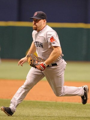 ST. PETERSBURG, FL - MAY 3: Infielder Kevin Youkilis #20 of the Boston Red Sox runs to field an infield hit against the Tampa Bay Rays May 3, 2009 at Tropicana Field in St. Petersburg, Florida. (Photo by Al Messerschmidt/Getty Images)
