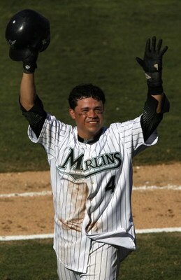 MIAMI - OCTOBER 1:  Alfredo Amezaga #4 of the Florida Marlins waves to fans after scoring the 11th inning game winning run against the Philadelphia Phillies on October 1, 2006 at Dolphin Stadium in Miami, Florida.  (Photo by Eliot J. Schechter/Getty Image
