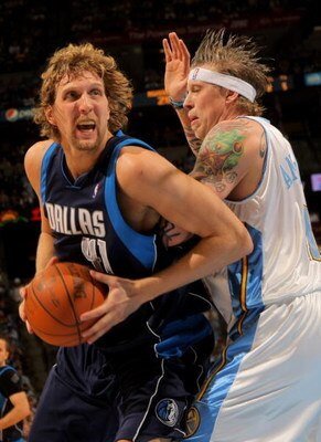 DENVER - MAY 05:  Dirk Nowitzki #41 of the Dallas Mavericks makes a move around the defense of Chris Andersen #11 of the Denver Nuggets in Game Two of the Western Conference Semifinals during the 2009 NBA Playoffs at Pepsi Center on May 5, 2009 in Denver,