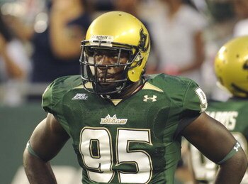 TAMPA, FL - SEPTEMBER 12: Defensive end George Selvie #95 of the University of South Florida Bulls watches play against the Kansas University Jayhawks at Raymond James Stadium on September 12, 2008 in Tampa, Florida.  (Photo by Al Messerschmidt/Getty Imag