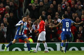 MANCHESTER, ENGLAND - APRIL 07:  Cristian Rodriguez of FC Porto celebrates after scoring the opening goal during the UEFA Champions League Quarter Final First Leg match between Manchester United and FC Porto at Old Trafford on April 7, 2009 in Manchester,
