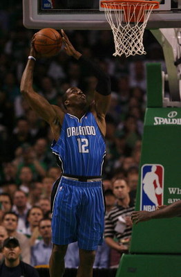 BOSTON - MAY 06:  Dwight Howard #12 of the Orlando Magic takes a shot in the first quarter against the Boston Celtics in Game Two of the Eastern Conference Semifinals during the 2009 NBA Playoffs at TD Banknorth Garden on May 6, 2009 in Boston, Massachuse
