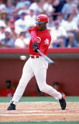 15 Mar 2000:  Ken Griffey Jr. #30 of the Cincinnati Reds hits the ball during the Spring Training Game against the Boston Red Sox at the Ed Smith Stadium in Sarasota, Florida. The Red Sox defeated the Reds 8-1. Mandatory Credit: Harry How  /Allsport