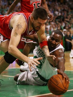 BOSTON - APRIL 28:  Brad Miller #52 of the Chicago Bulls Kendrick Perkins #43 of the Boston Celtics go after the loose ball in Game Five of the Eastern Conference Quarterfinals during the 2009 NBA Playoffs at TD Banknorth Garden on April 28, 2009 in Bosto