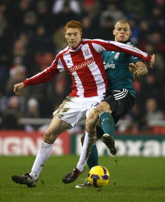 STOKE, UNITED KINGDOM - JANUARY 10:  Dave Kitson of Stoke City battles for the ball with Martin Skrtel of Liverpool during the Barclays Premier League match between Stoke City and Liverpool at the Britannia Stadium on January 10, 2009 in Stoke, England. (