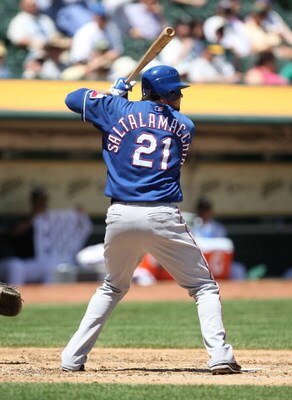 OAKLAND, CA - MAY 07:  Jarrod Saltalamacchia #21 of the Texas Rangers bats against the Oakland Athletics during a Major League Baseball game on May 7, 2009 at the Oakland Coliseum in Oakland, California.  (Photo by Jed Jacobsohn/Getty Images)