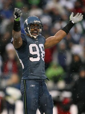 SEATTLE - DECEMBER 21:  Linebacker Julian Peterson  #98 of the Seattle Seahawks exhorts the crowd during the game against the New York Jets on December 21, 2008 at Qwest Field in Seattle, Washington. The Seahawks defeated the Jets 13-3.(Photo by Otto Greu