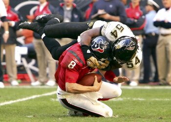 HOUSTON - DECEMBER 24:  Mike Peterson #54 of the Jacksonville Jaguars sacks quarterback David Carr #8 of the Houston Texans on December 24, 2005 at Reliant Stadium in Houston, Texas. The Jaguars won 38-20.  (Photo by Lisa Blumenfeld/Getty Images)