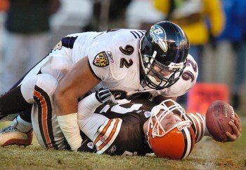 CLEVELAND, OH - DECEMBER 21:  Quarterback Tim Couch #2 of the Cleveland Browns is sacked by Maake Kemoeatu #92 of the Baltimore Ravens during the fourth quarter on December 21, 2003 at Cleveland Browns Stadium in Cleveland, Ohio. Baltimore defeated Clevel